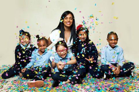 Yoobi Gives Confetti Image of a teacher with kids